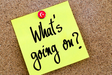 Written text What Is Going On ? over yellow paper note