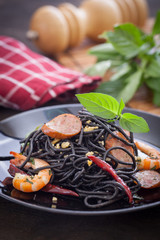 Black spaghetti with shrimps and sausage