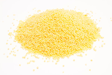 millet groats on the white background