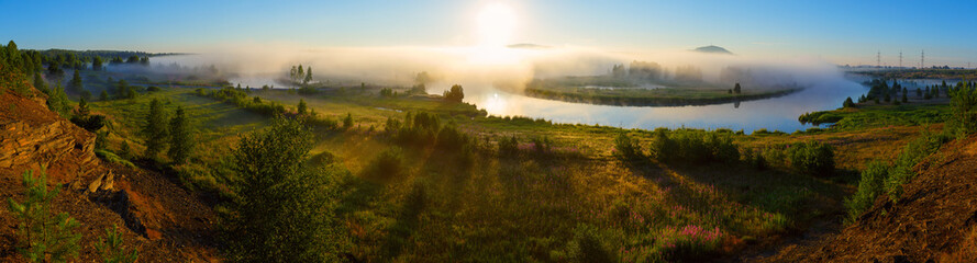 Fototapeta na wymiar dawn on the foggy river, russian nature