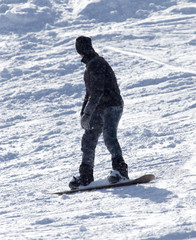 Fototapeta na wymiar man snowboarding in the winter