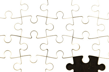 Fototapeta premium fill the gaps, white jigsaw/puzzle white one gap over black wooden table background, symbol of problem solving