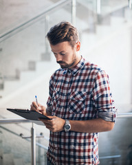 Casual worker with checklist

