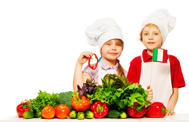 Young Italian cooks preparing fresh salad