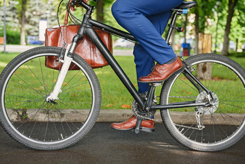 Fototapeta premium Healthy man going to work by bike