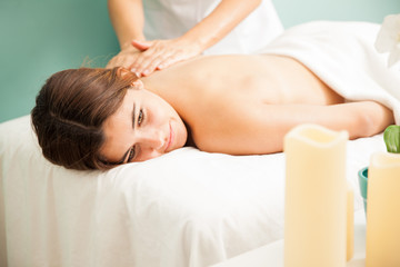 Fototapeta na wymiar Getting a back massage at the spa