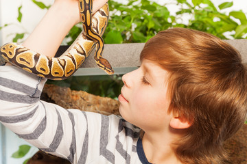 Young boy with pet snake - Royal or Ball Python