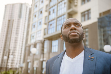 Thoughtful African man ready to work in town