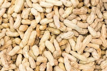 Many peanuts in shells, one upon the other