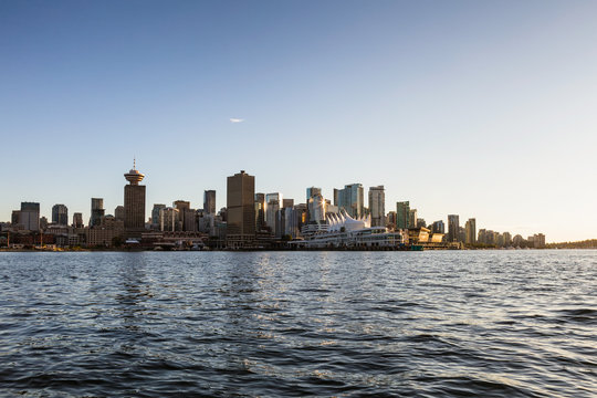 Vancouver Downtown, BC, Canada, City Skyline. Picture taken from water during sunset.