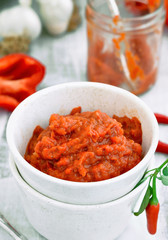 Ajvar. Balkan cuisine. Relish of roasted red pepper and eggplant in a bowl, Close-up
