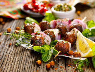 Kofta skewers, meatballs and red onion with addition of fresh mint and thyme,delicious  oriental...