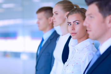 Fototapeta premium Smiling successful business team standing in office
