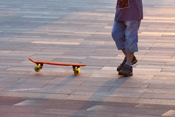 young people riding on a skateboard
