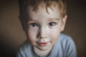 Close Up Portrait of a Cute Young Boy / A close up portrait of a cute young boy looking at the camera.