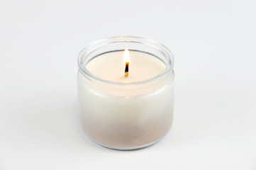 Fototapeta na wymiar candle flame fire of decorative candle on white background