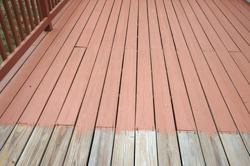 partially painted old wood deck