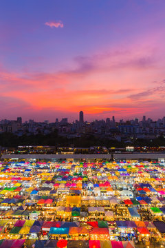 Aerial view multiple colour weekend market roof top with beautiful sunset sky background