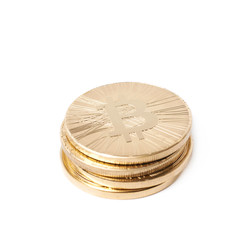Pile of bitcoin currency tokens isolated