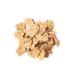 Pile of wholegrain cereal flakes isolated