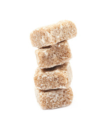 Fototapeta na wymiar Pile of brown sugar cubes isolated