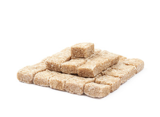 Pile of brown sugar cubes isolated