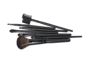 Pile of makeup tools and brushed isolated