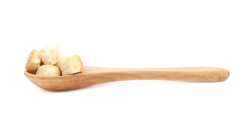 Spoon full of croutons isolated