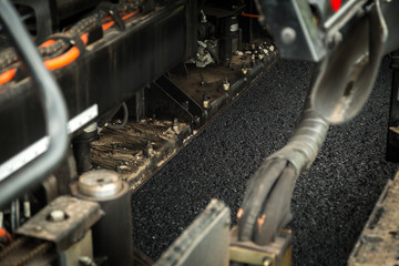 Road construction works with roller compactor machine and asphalt finisher