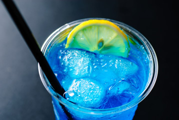 a glass of blue curacao cocktail