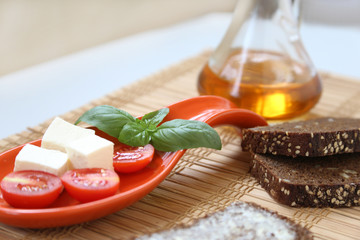Fresh cherry tomatoes and kalamata olives on toast.
