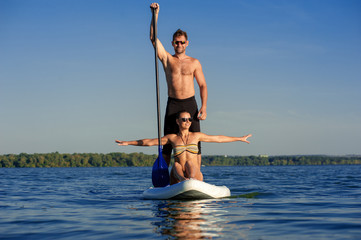 beach fun couple on stand up paddle board SUP04
