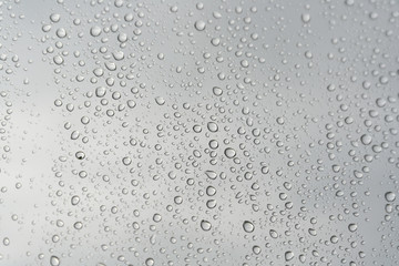 Fototapeta na wymiar Drops of rain on the window