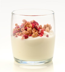 glass of yogurt and cereals with red fruits