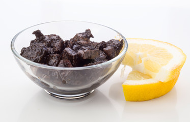 squid sauce with lemon on white