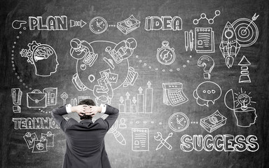 Businessman looking at success sketch