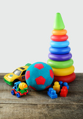 toys collectionon wooden table and white background