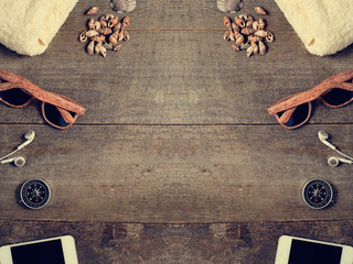 Travel items on wooden table. Summer time sea vacation backgroun