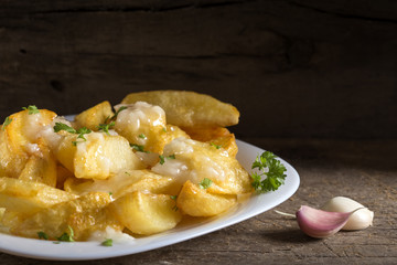 Homemade french fries (potatoes) with garlic sauce