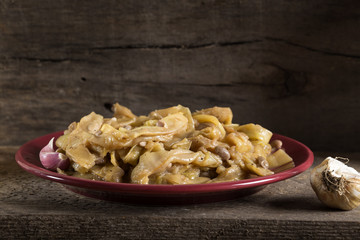 Cooked broad bean pods with garlic