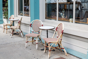 Chairs and Round Tables on Sidewalk