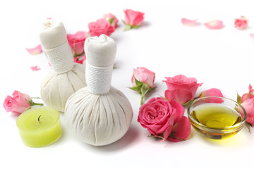 Obraz na płótnie Canvas Herbal compress balls for spa treatment with rose flower