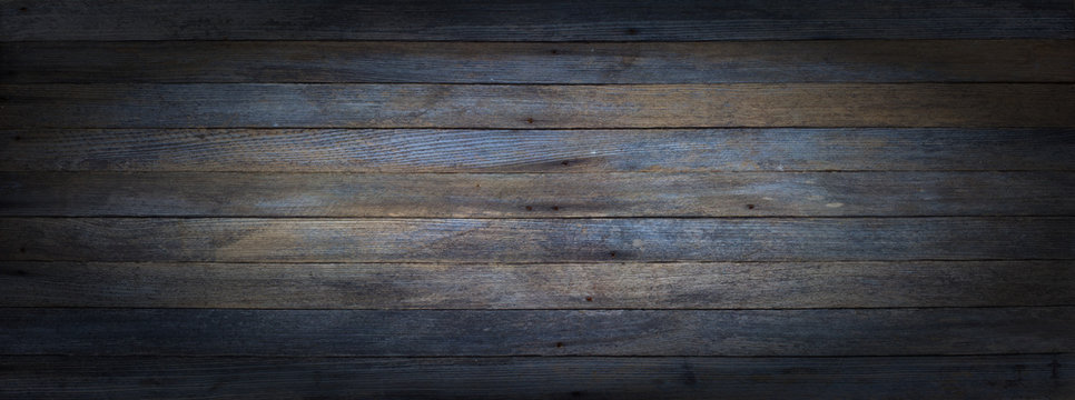 panoramic grunge background of old wooden boards with vignette