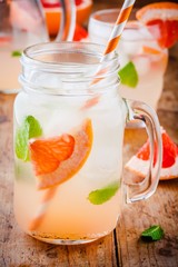 cold grapefruit cocktail with mint in glass