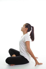 Fototapeta premium Portrait of young woman meditating in pose