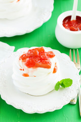 Dessert of meringue with rhubarb and mint sauce.