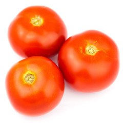 Three fresh. red tomatoes isolated on white background