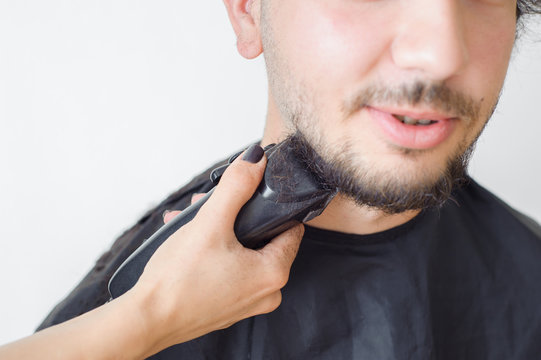 Men's hairstyling and haircutting in a barber shop or hair salon