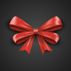 Gift realistic red bow and ribbons tilted on a black background. Beautiful vector illustration EPS 10