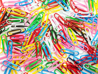 Pile of colorful paper clip on white background